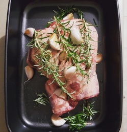 fresh lamb prepped with rosemary and garlic to go in the oven
